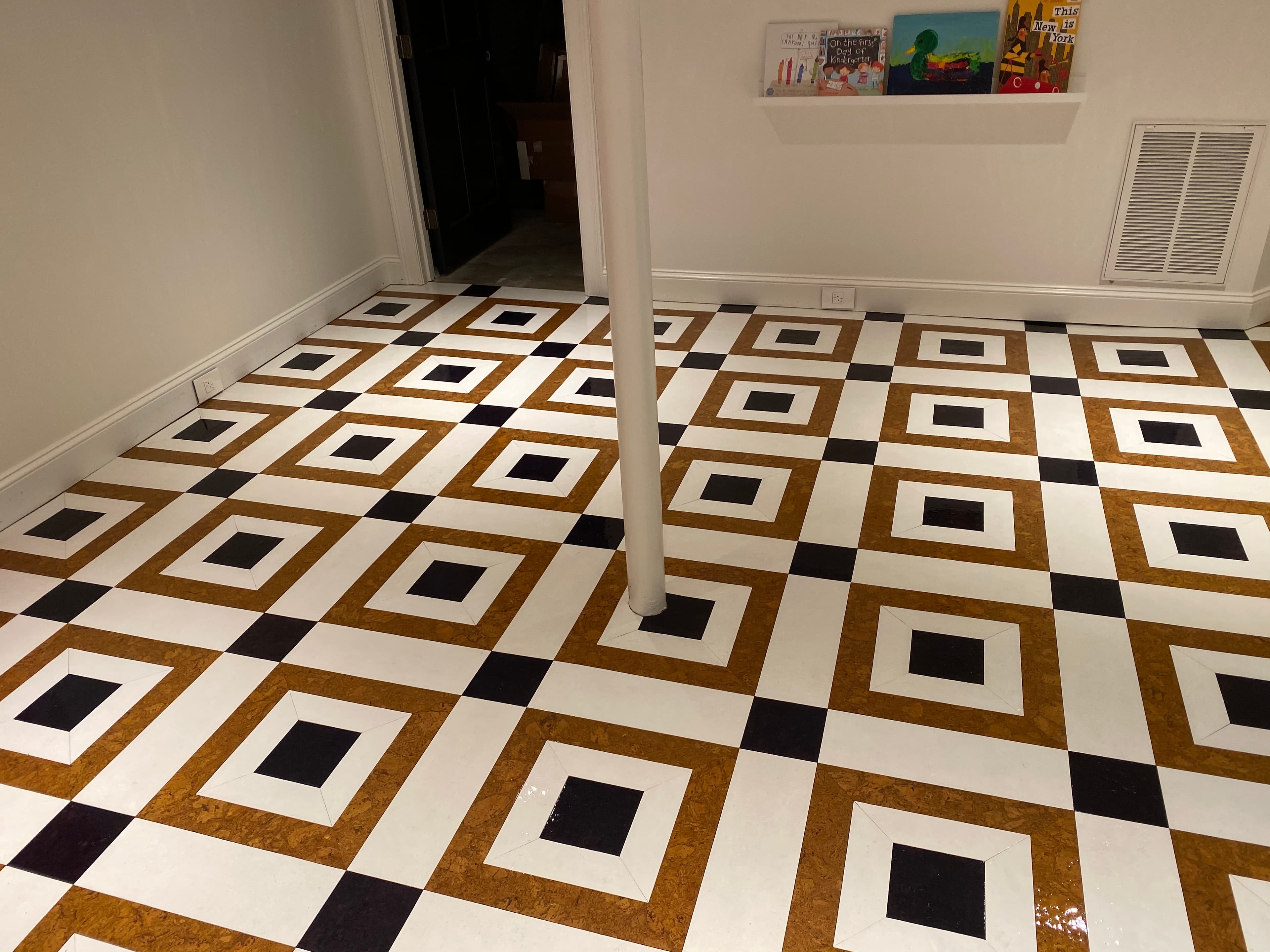 Custom patterned cork floor installation with geometric black white and natural design by 12th And Oak Floor Co. serving Raleigh NC