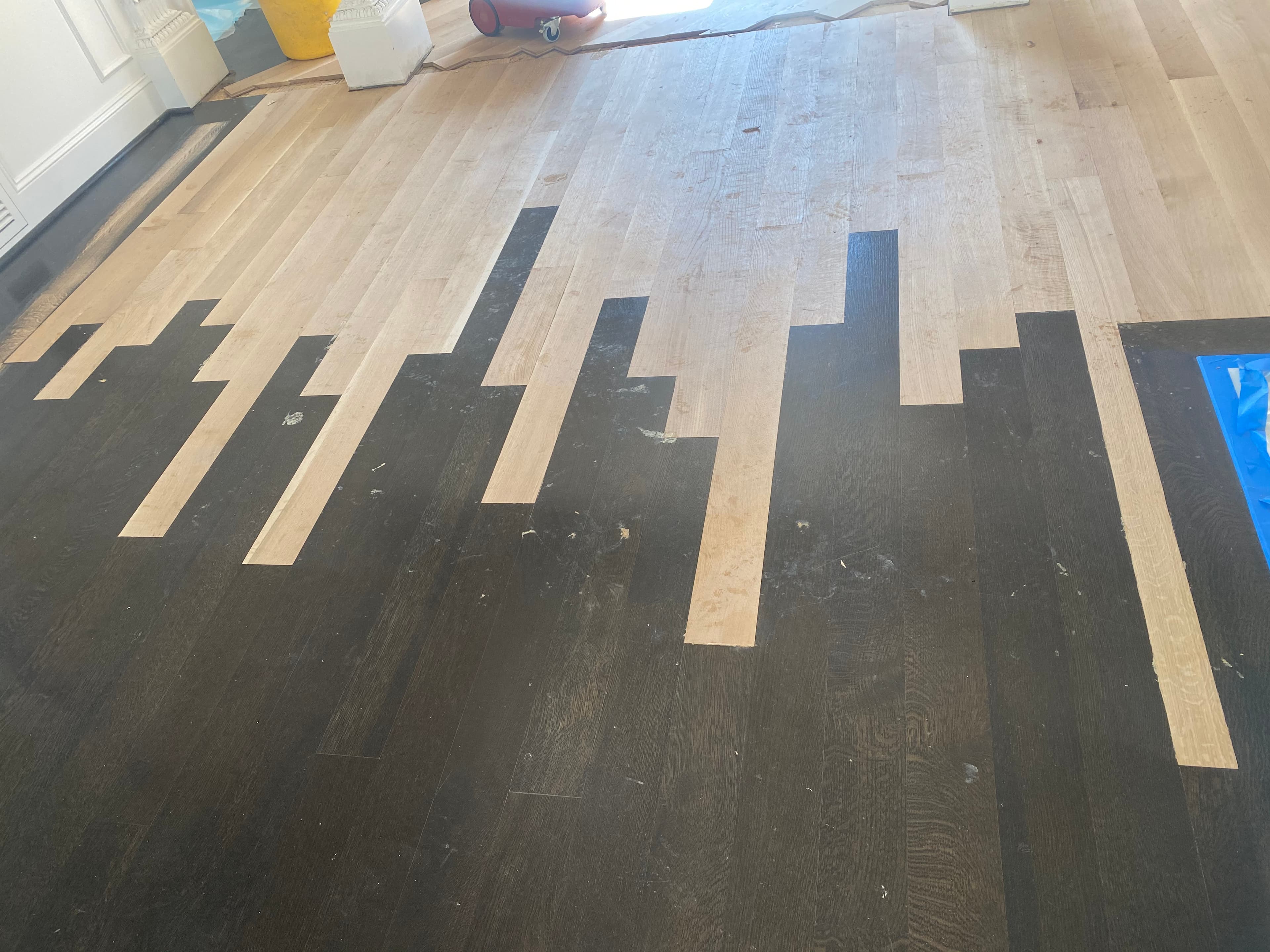 Completed hardwood floor lace-in repair after water damage in Raleigh NC ready for refinishing by 12th And Oak Floor Co.