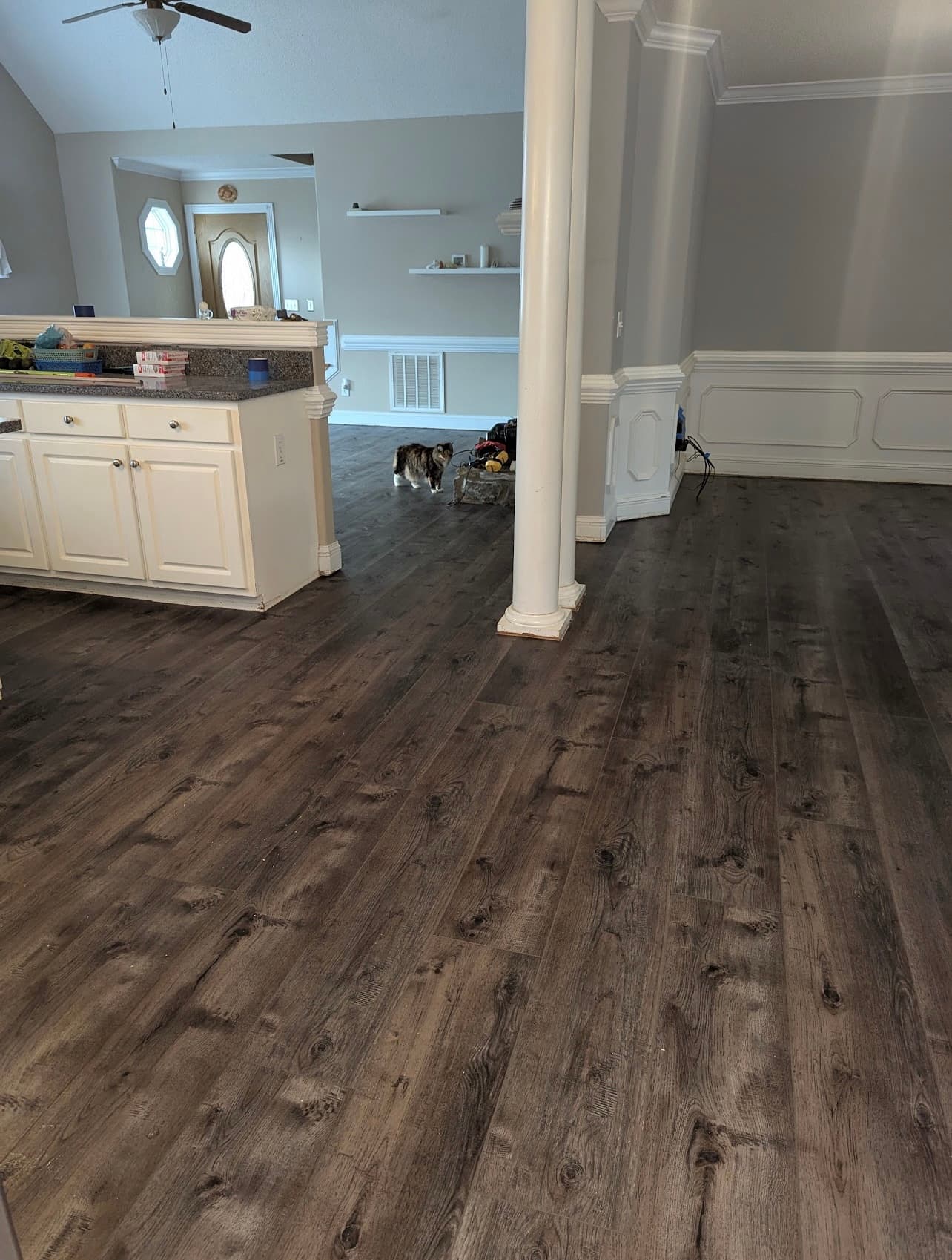Completed LVP flooring installation in open concept kitchen and living area in Clayton NC by 12th And Oak Floor Co.