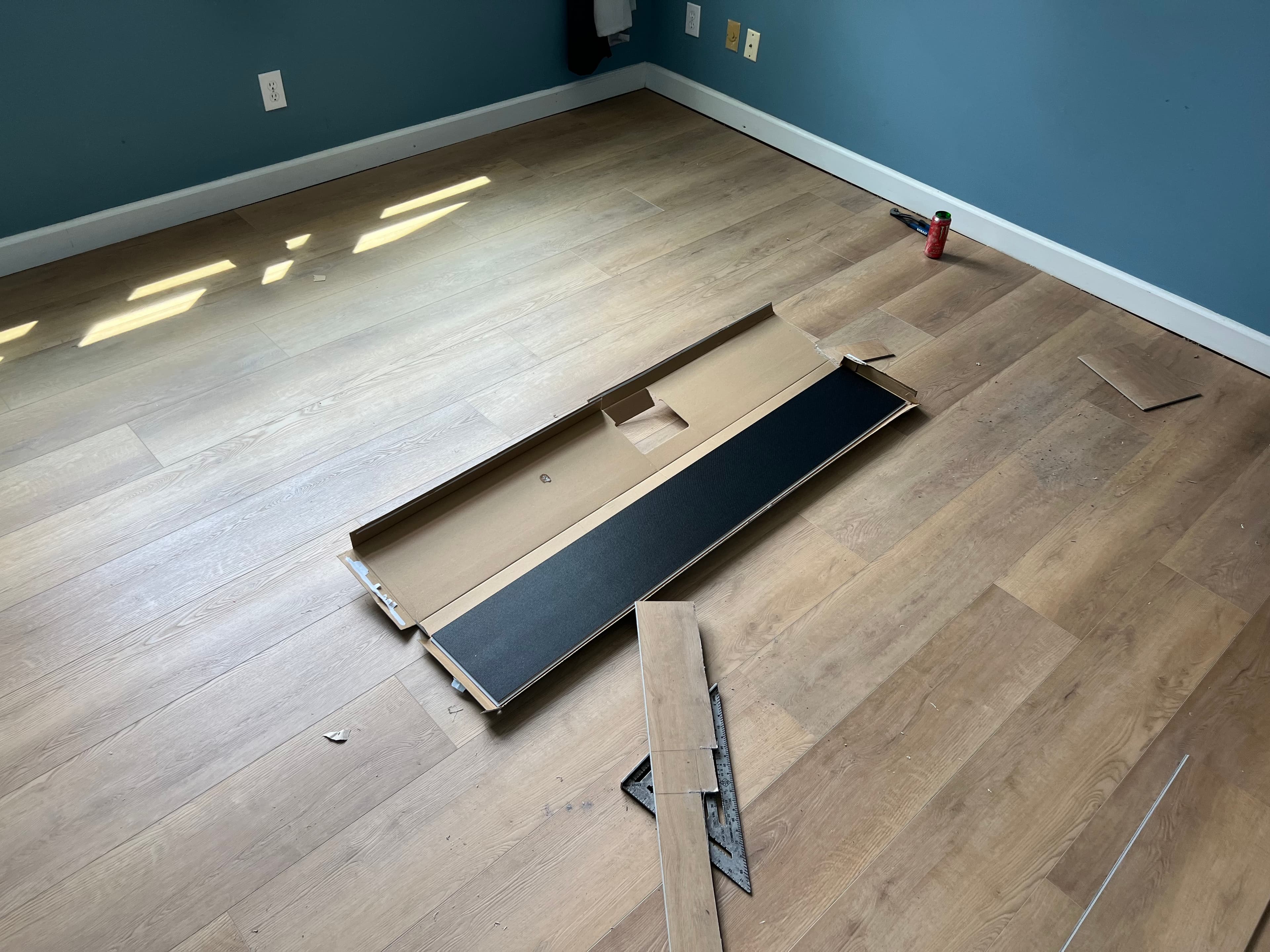 Wide plank LVP flooring installation in progress in residential room by 12th And Oak Floor Co.
