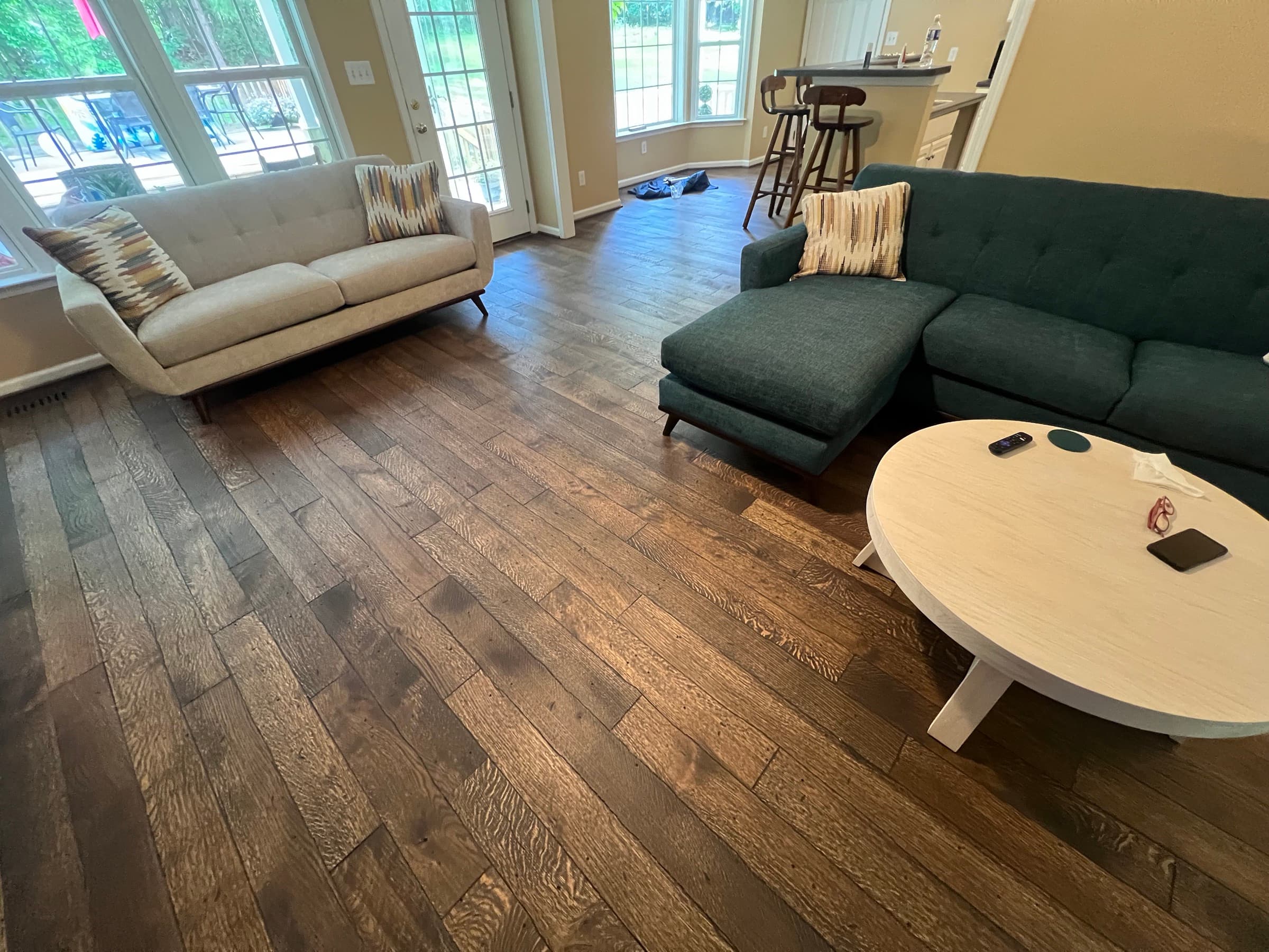 Finished distressed white oak living room with furniture and natural light in Westlake Wendell NC