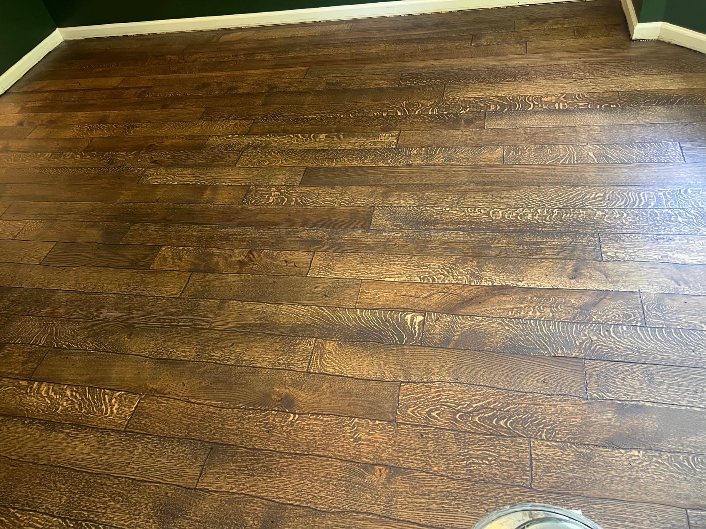 Distressed rift and quartered white oak hardwood floor full field view in Westlake Wendell NC, dark custom hardwax oil finish