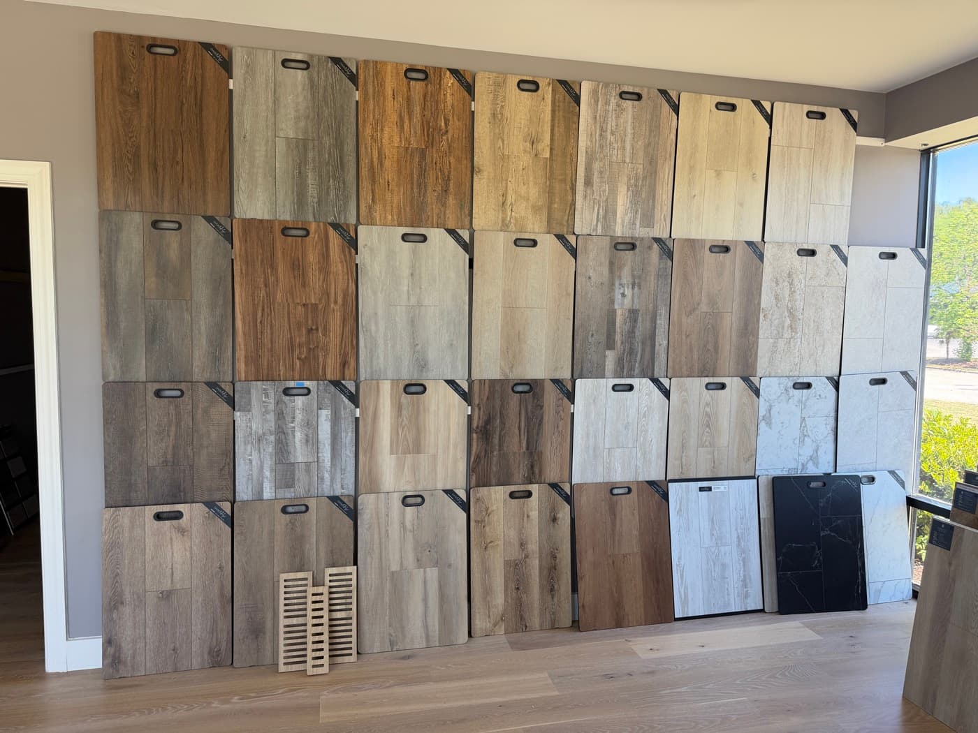 LVP and LVT sample wall in the 12th And Oak showroom in Clayton NC
