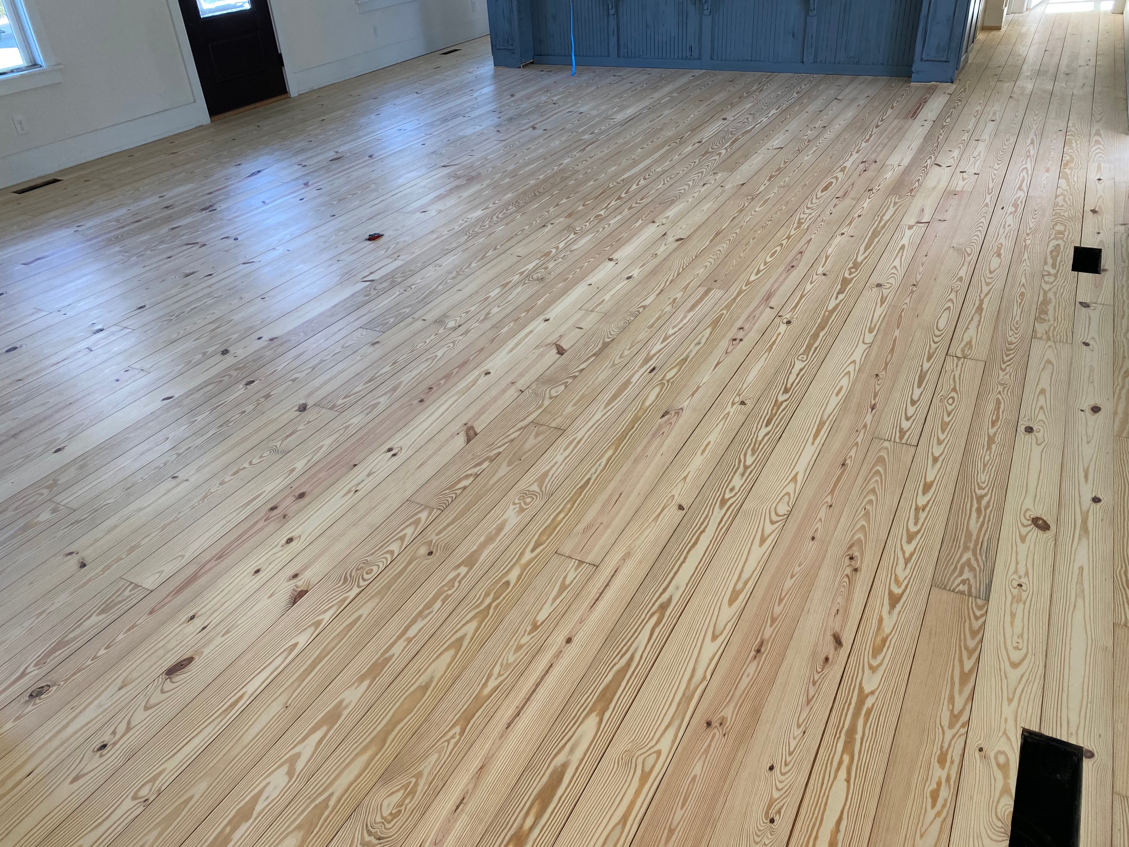 Southern yellow pine hardwood floors freshly sanded in Flowers Plantation home in Clayton NC by 12th And Oak Floor Co.