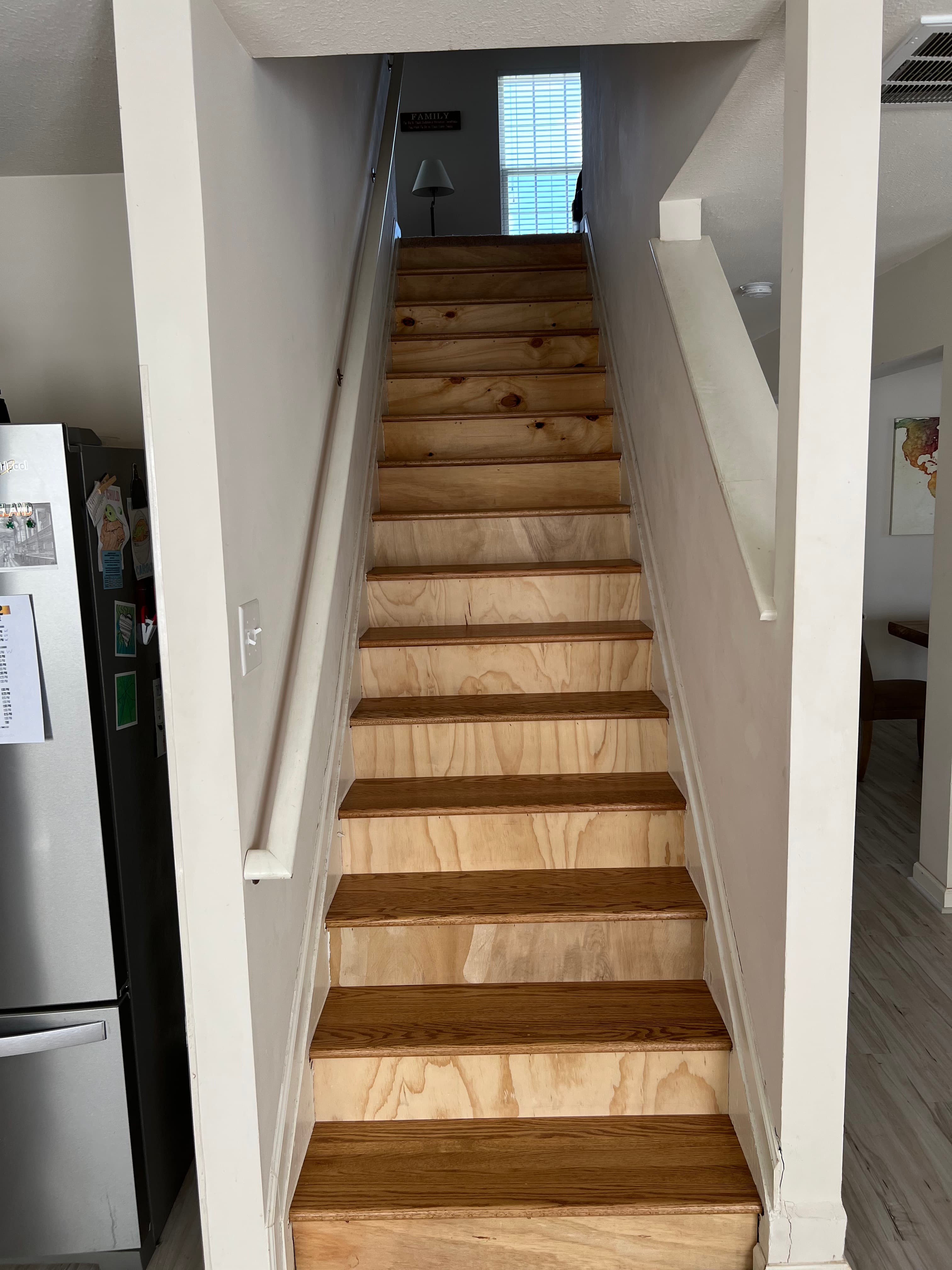 staircase before remodeling showing raw treads ready for hardwood installation Clayton NC