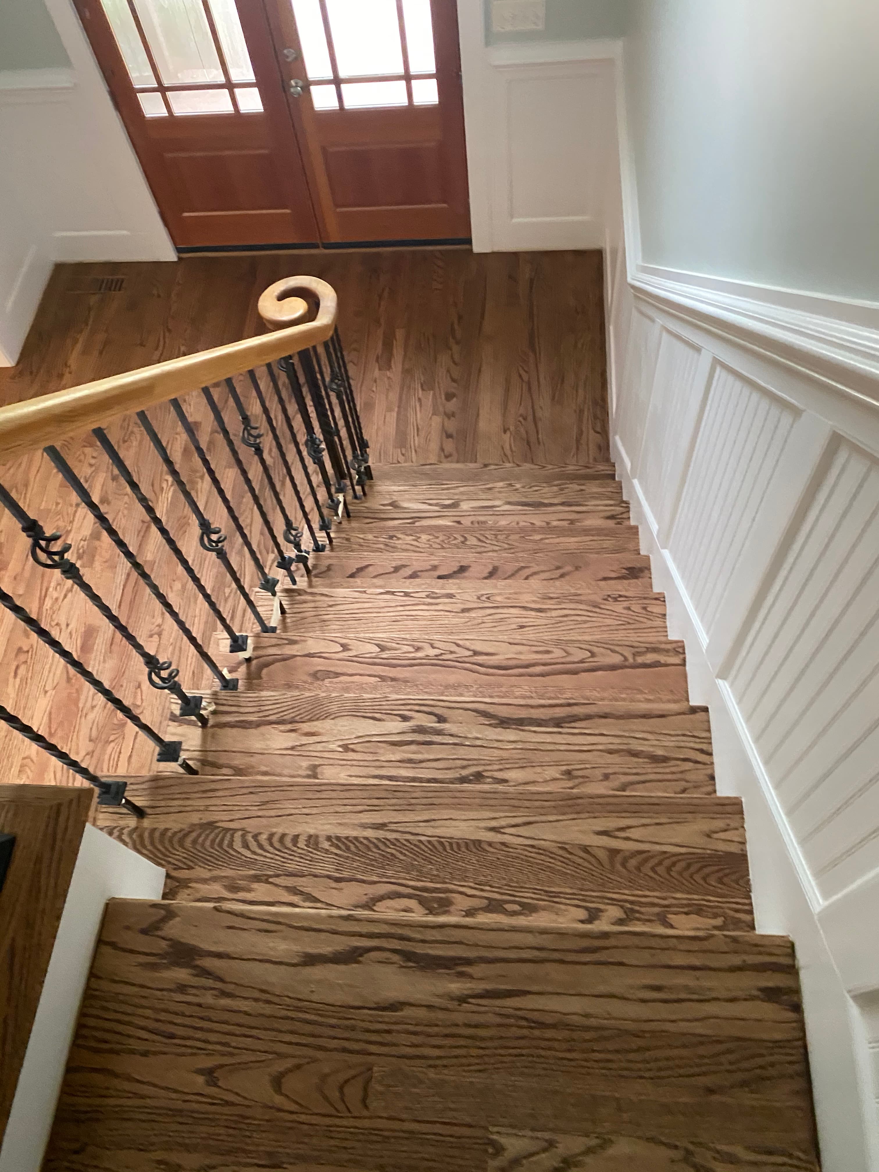 red oak staircase remodeling with iron balusters Clayton NC