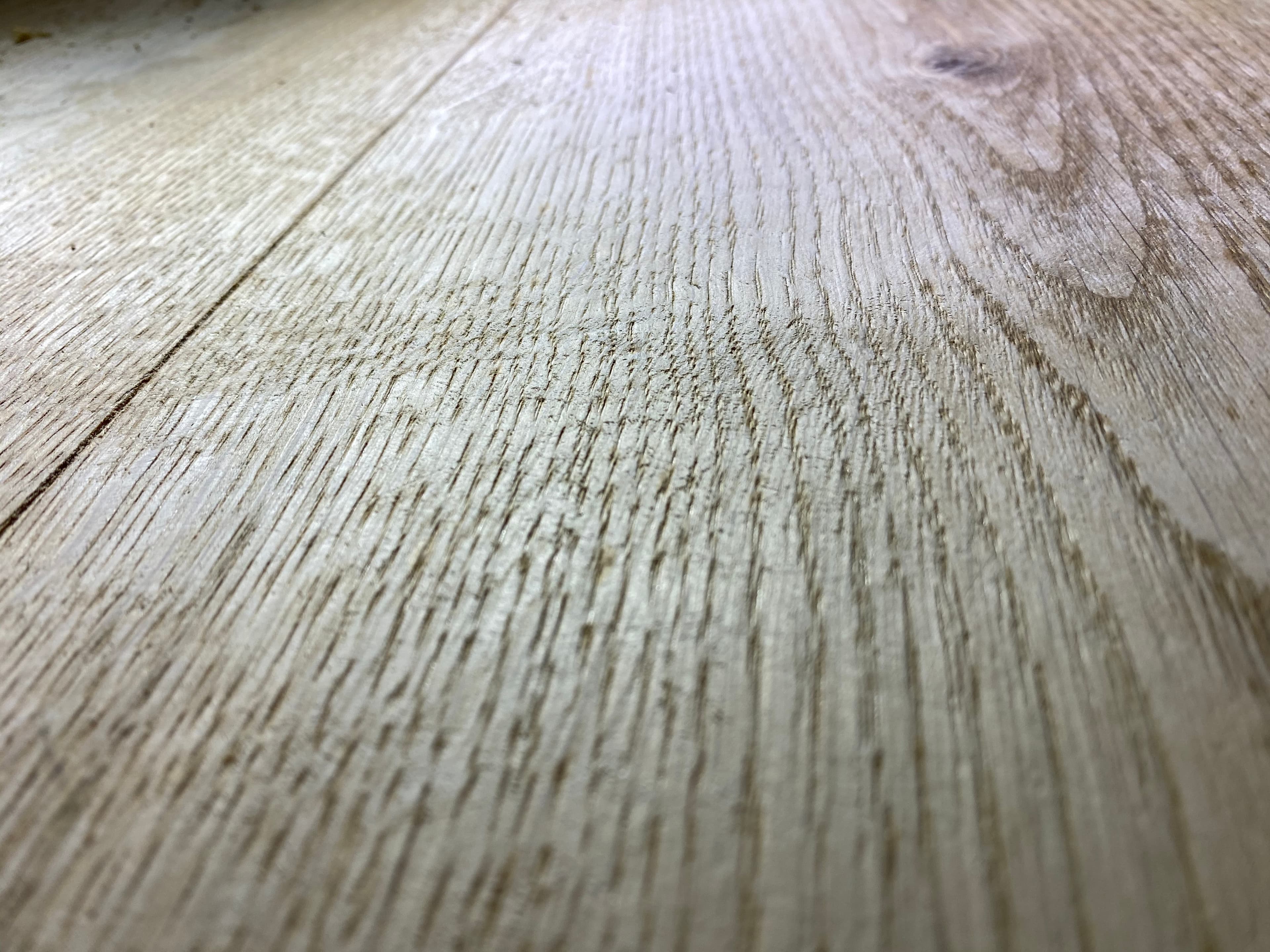 Close up wire brushed texture on wide plank European white oak hardwood floor by 12th And Oak Floor Co. Clayton NC